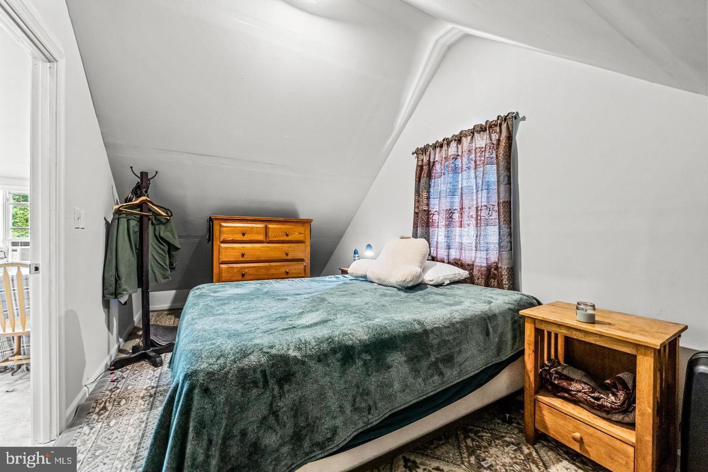 668 Crawford Road Cape May, NJ 08204 - Photo 53 of 66 a bedroom with a bed and a window