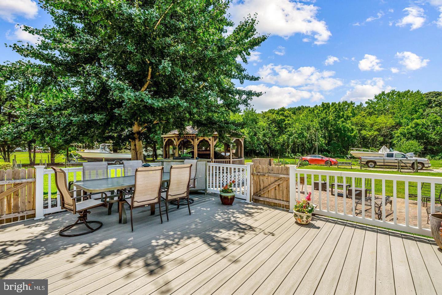 668 Crawford Road Cape May, NJ 08204 - Photo 55 of 66 a view of balcony with chairs and wooden fence