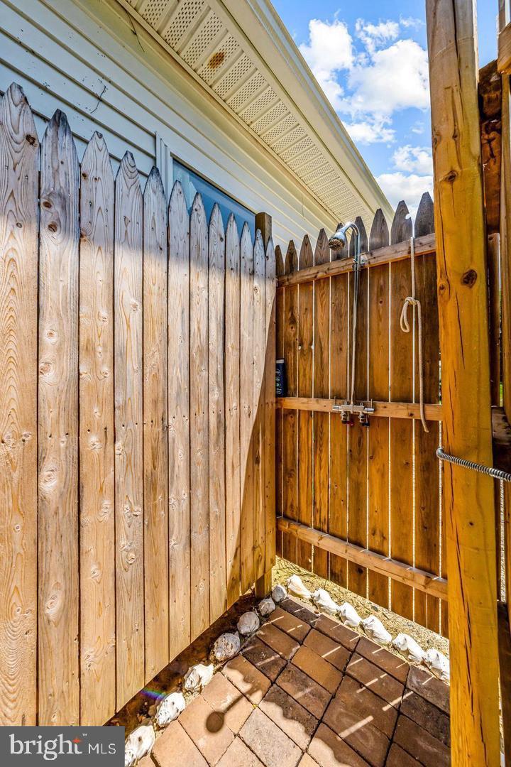 668 Crawford Road Cape May, NJ 08204 - Photo 58 of 66 a view of a house with a wooden fence