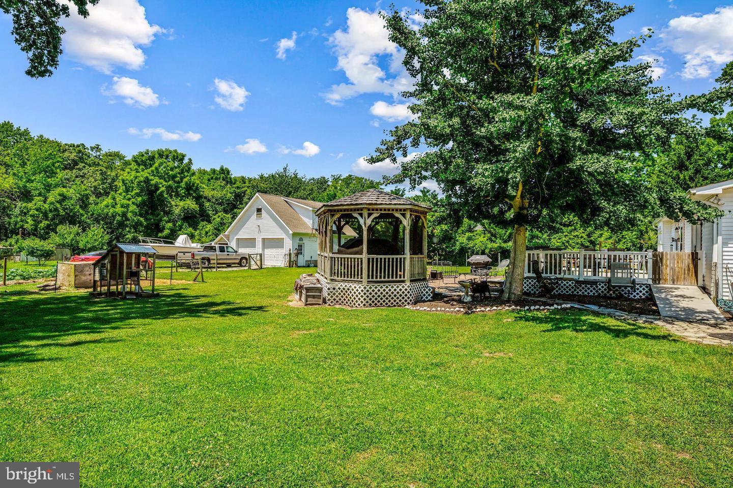 668 Crawford Road Cape May, NJ 08204 - Photo 60 of 66 a view of a house with backyard sitting area and garden