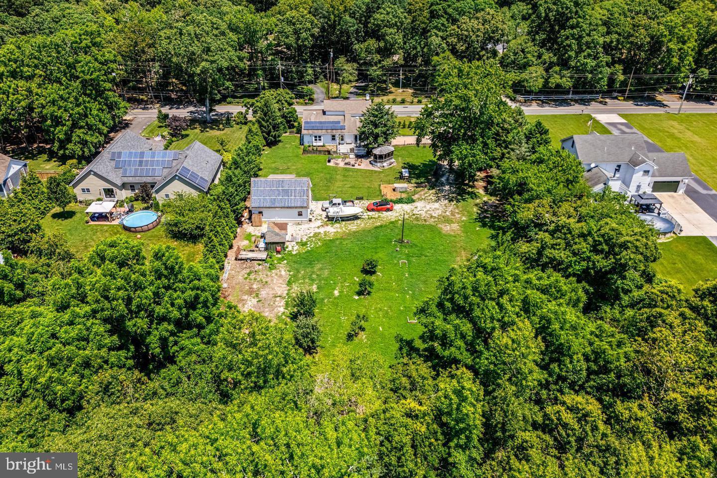 668 Crawford Road Cape May, NJ 08204 - Photo 7 of 66 an aerial view of residential houses with outdoor space and swimming pool