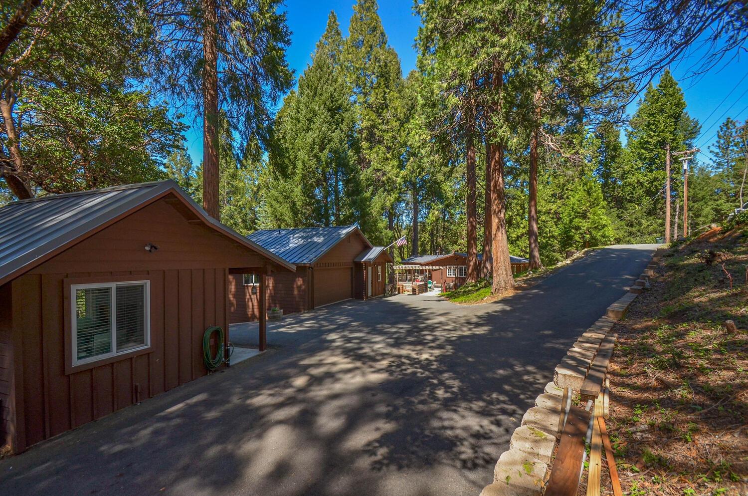 a view of a house with a tree in front of it
