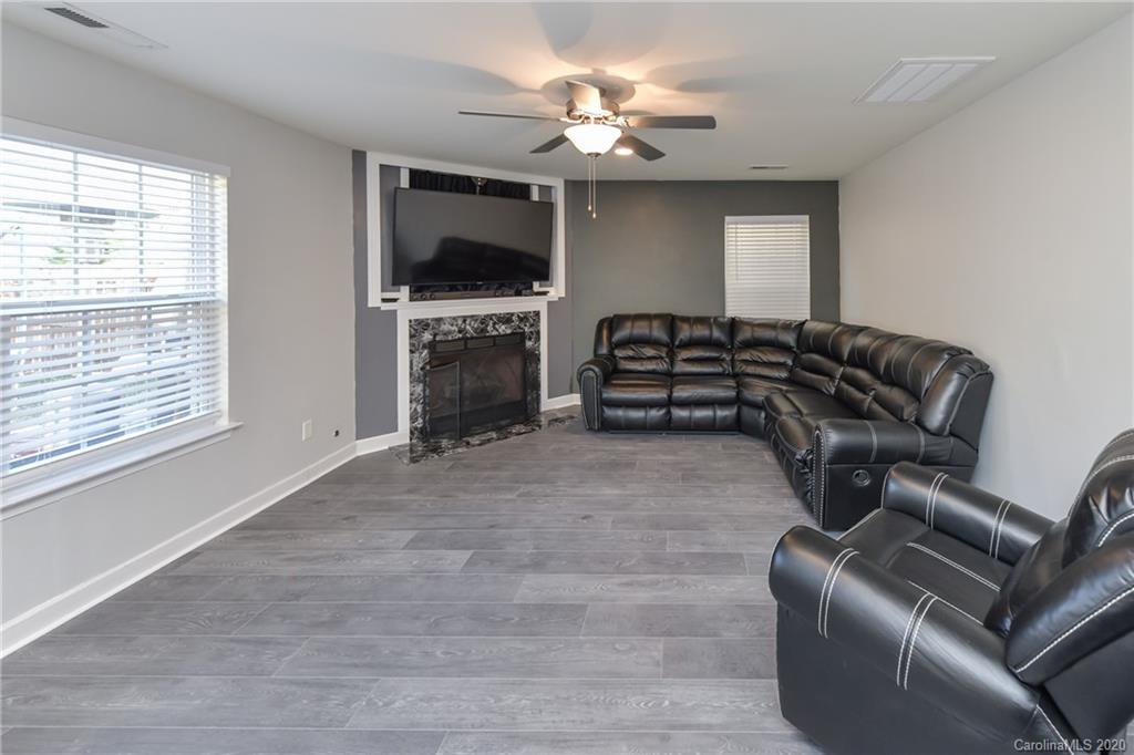 717 Jones Branch Road Fort Mill, SC 29715 - Photo 12 of 31 a living room with furniture and a flat screen tv
