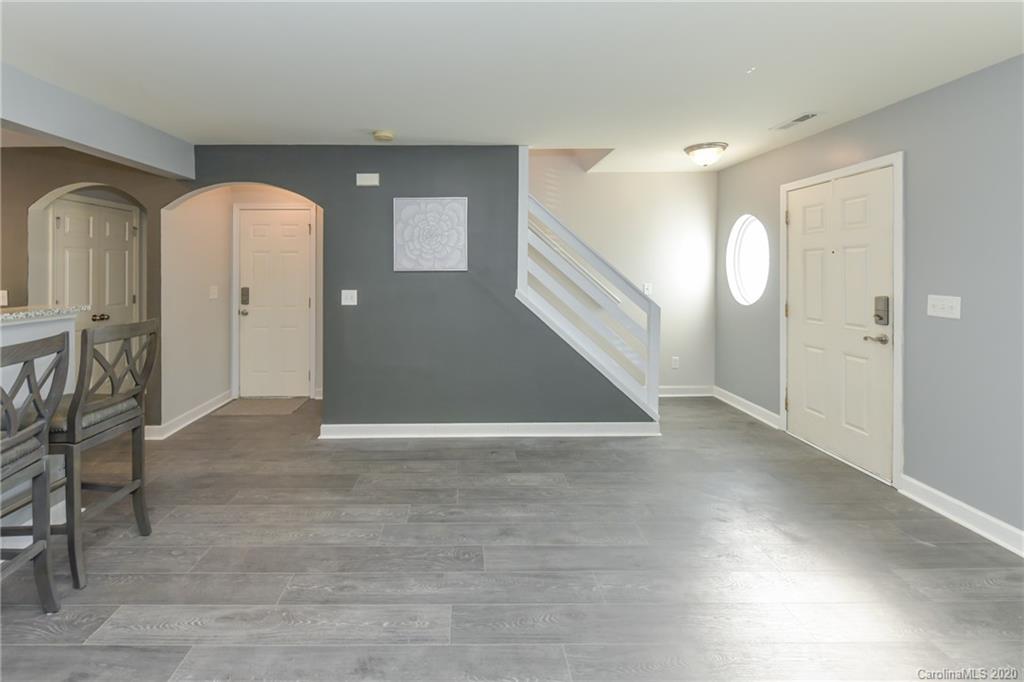 717 Jones Branch Road Fort Mill, SC 29715 - Photo 16 of 31 a view of a hallway with wooden floor