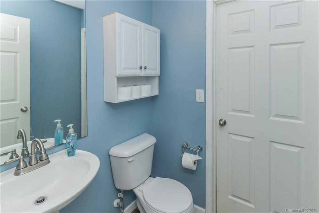 717 Jones Branch Road Fort Mill, SC 29715 - Photo 19 of 31 a bathroom with a toilet a sink and mirror