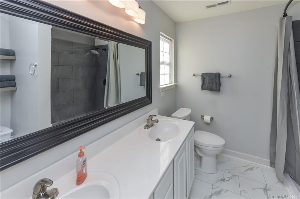 717 Jones Branch Road Fort Mill, SC 29715 - Photo 22 of 31 a bathroom with a sink and a mirror