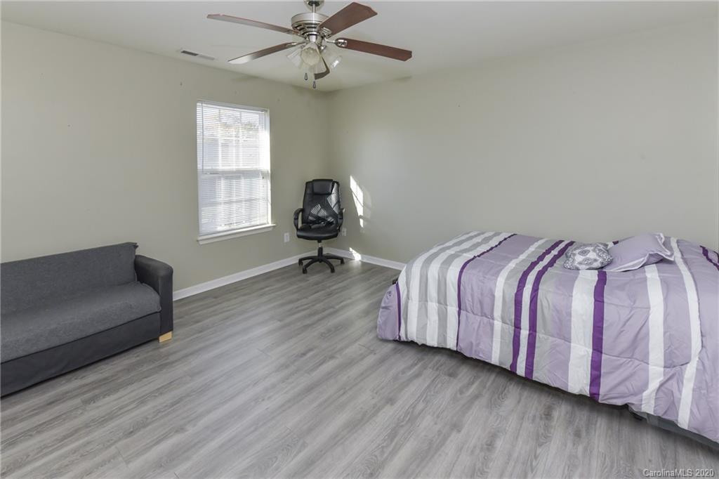 717 Jones Branch Road Fort Mill, SC 29715 - Photo 24 of 31 a bedroom with a bed and window