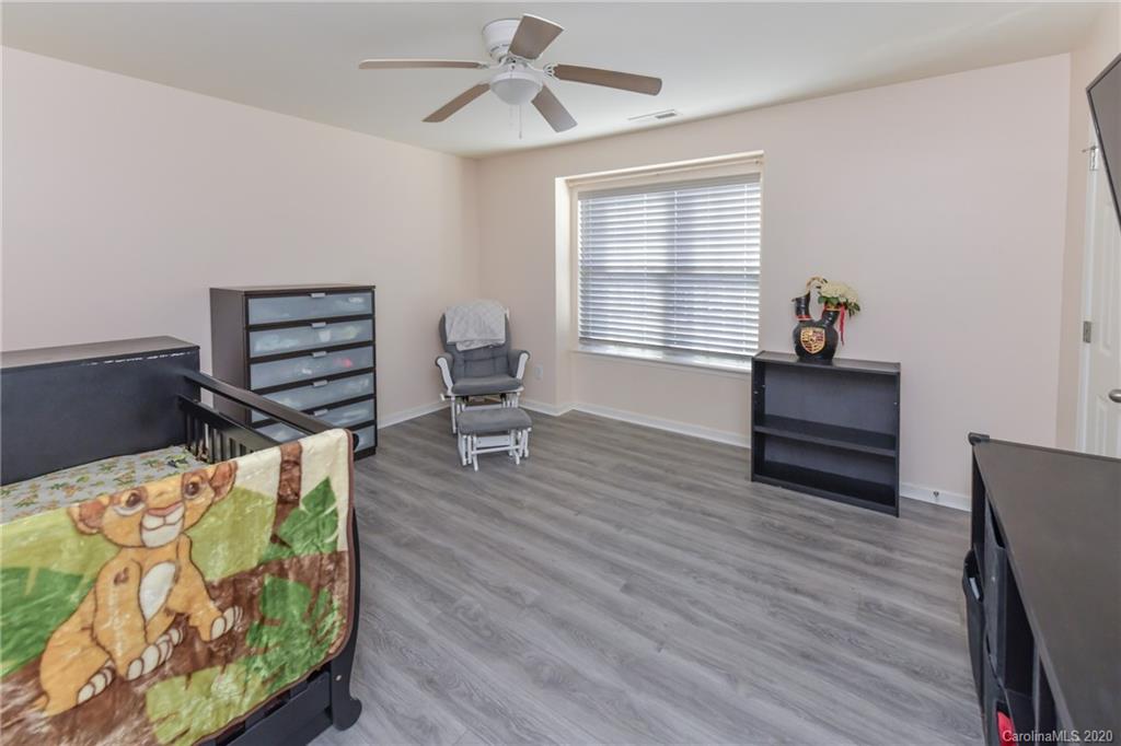 717 Jones Branch Road Fort Mill, SC 29715 - Photo 25 of 31 a living room with furniture and a wooden floor