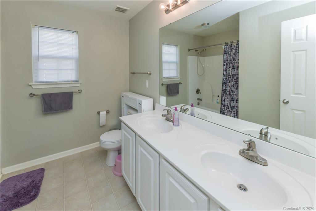717 Jones Branch Road Fort Mill, SC 29715 - Photo 27 of 31 a bathroom with a sink toilet and mirror