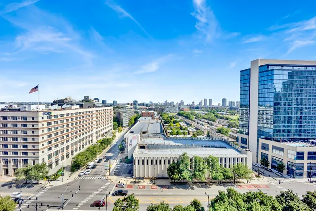 a view of a city with tall buildings