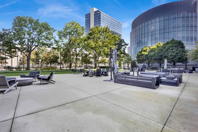 a view of a patio with couches and a fire pit