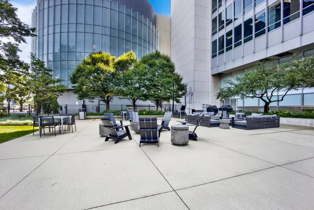 a view of swimming pool with outdoor seating and plants