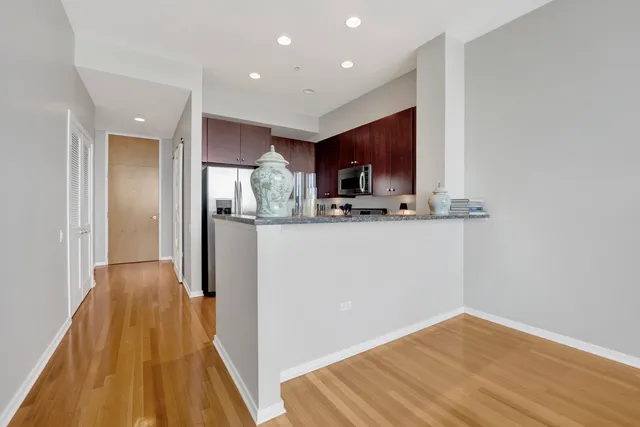 a view of a kitchen from the hallway