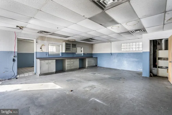a view of kitchen and cabinets