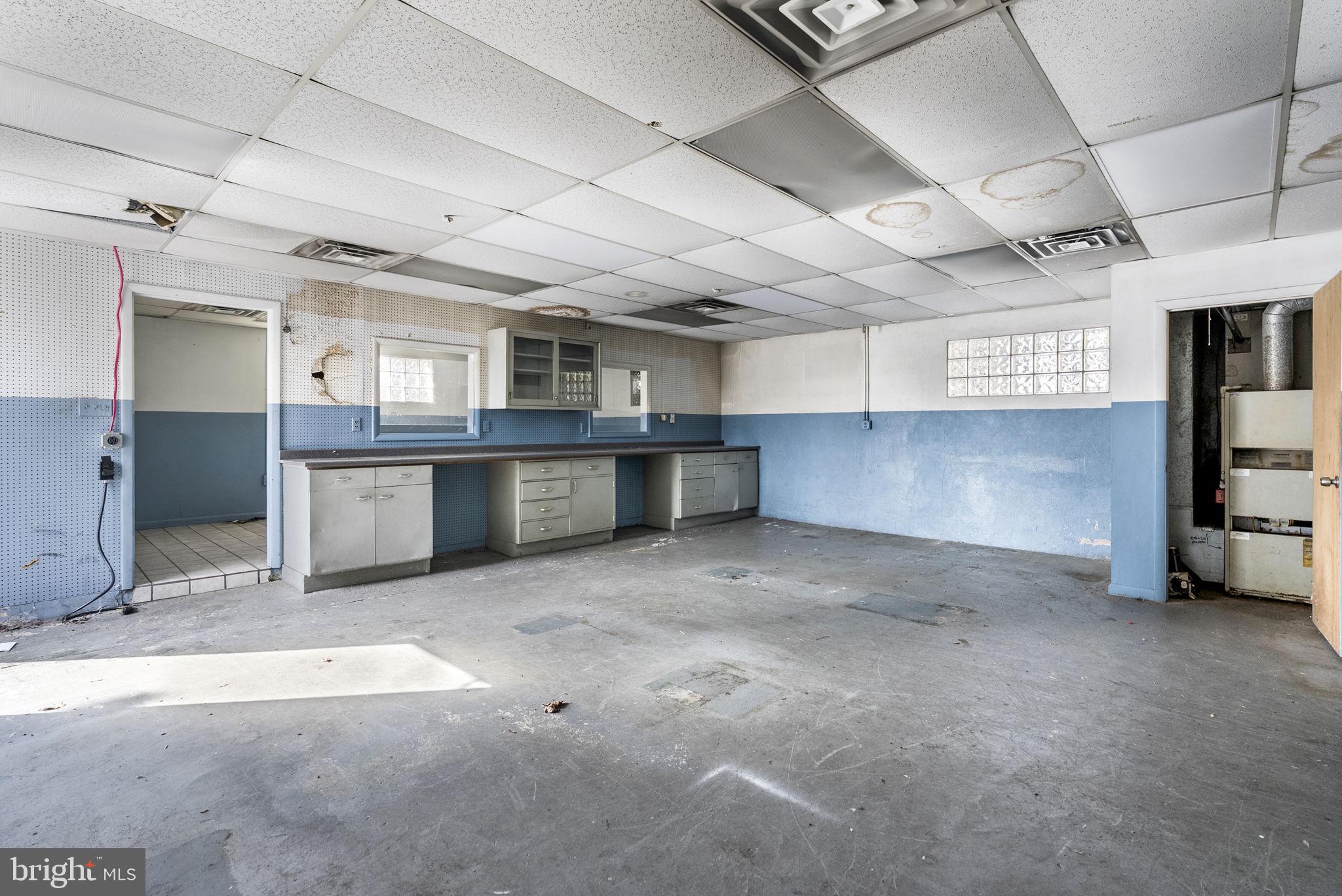 1013 Rapp Alley Norristown, PA 19401 - Photo 11 of 23 a large room with stainless steel appliances kitchen island granite countertop lots of wooden cabinets a sink and a counter top space