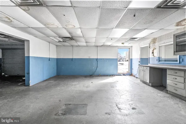 a view of an empty room with windows