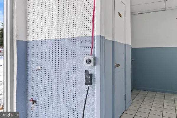 a view of a room with wooden walls