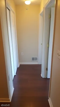 a bathroom with a toilet and a mirror