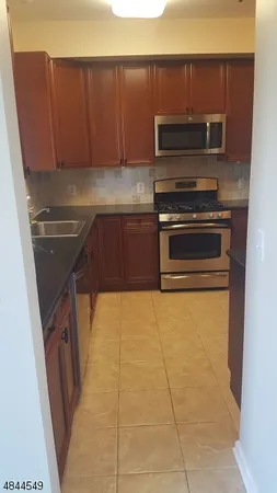 a kitchen with a stove and a microwave