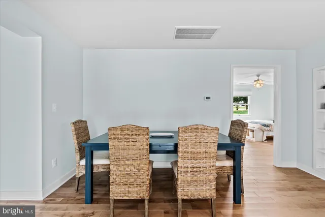 a balcony view with two chairs and a table