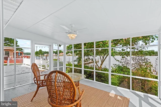 a view of a chair and tables in the balcony