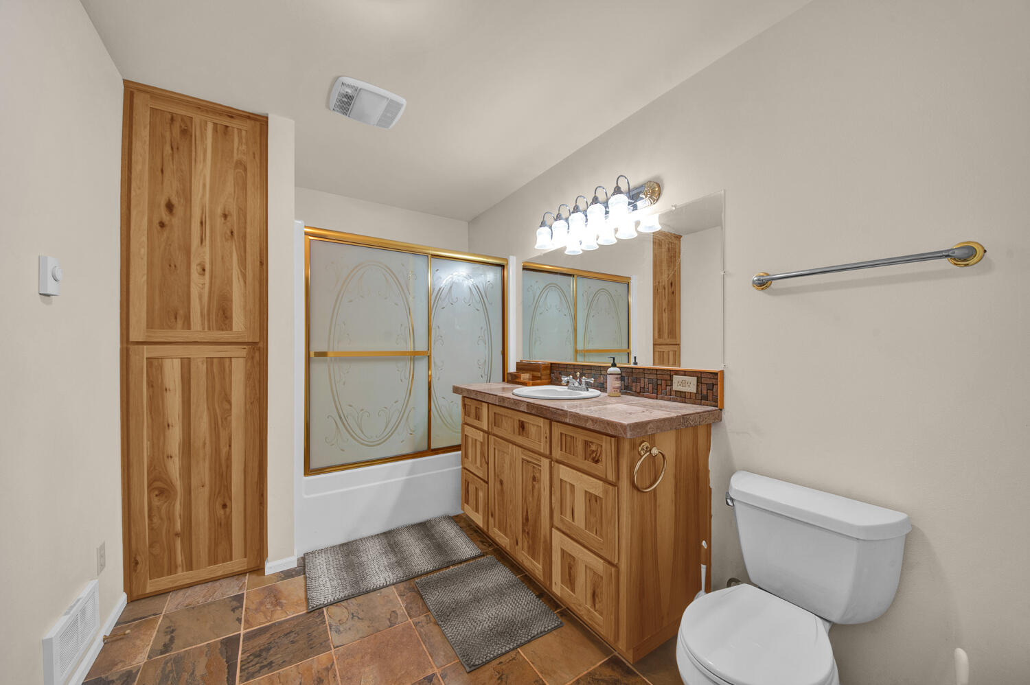 67100 Fryrear Road Bend, OR 97703 - Photo 35 of 38 a view of bathroom with a toilet sink and mirror