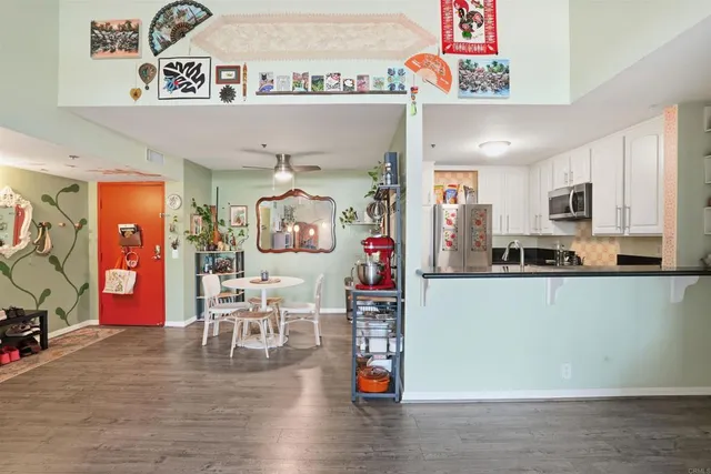 a kitchen with stainless steel appliances granite countertop a refrigerator and microwave