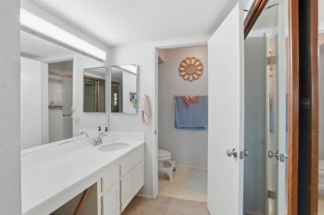 a bathroom with a shower and a sink