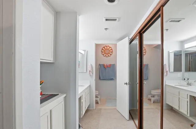 a view of a livingroom with workspace and a window