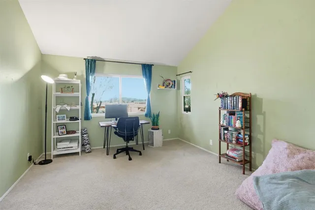 a view of a workspace with furniture