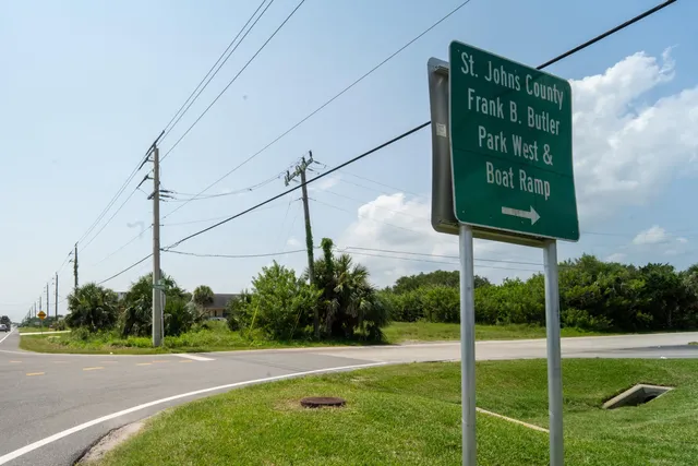 a view of a golf course with a lake