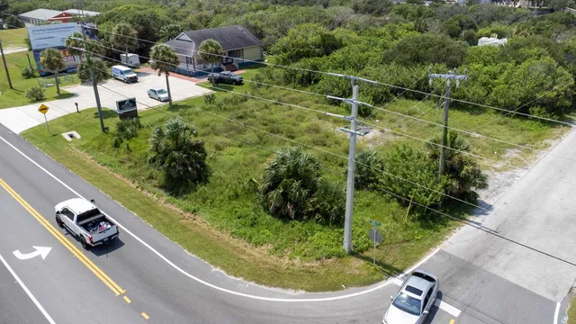 an aerial view of a house with outdoor space