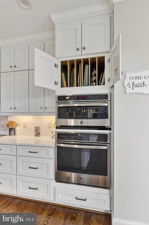 a balcony with chairs and a table