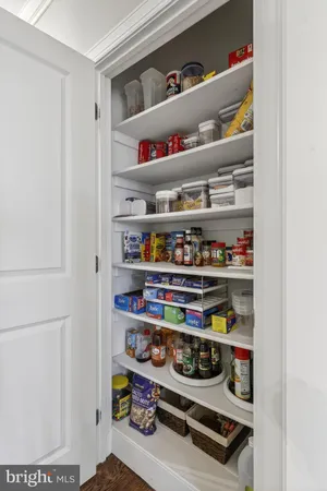 a bedroom with furniture and large windows