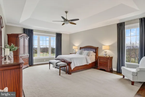 a view of a livingroom with furniture and a ceiling fan
