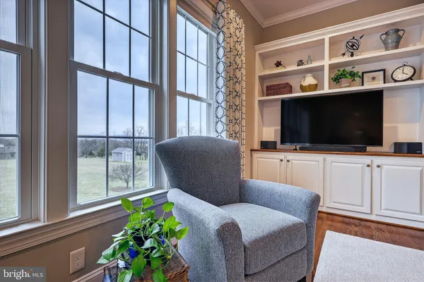 a bedroom with two beds and a chandelier