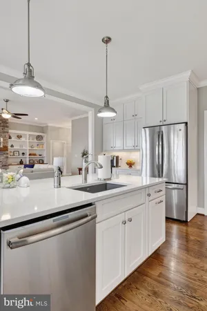 a bathroom with a granite countertop toilet sink and mirror