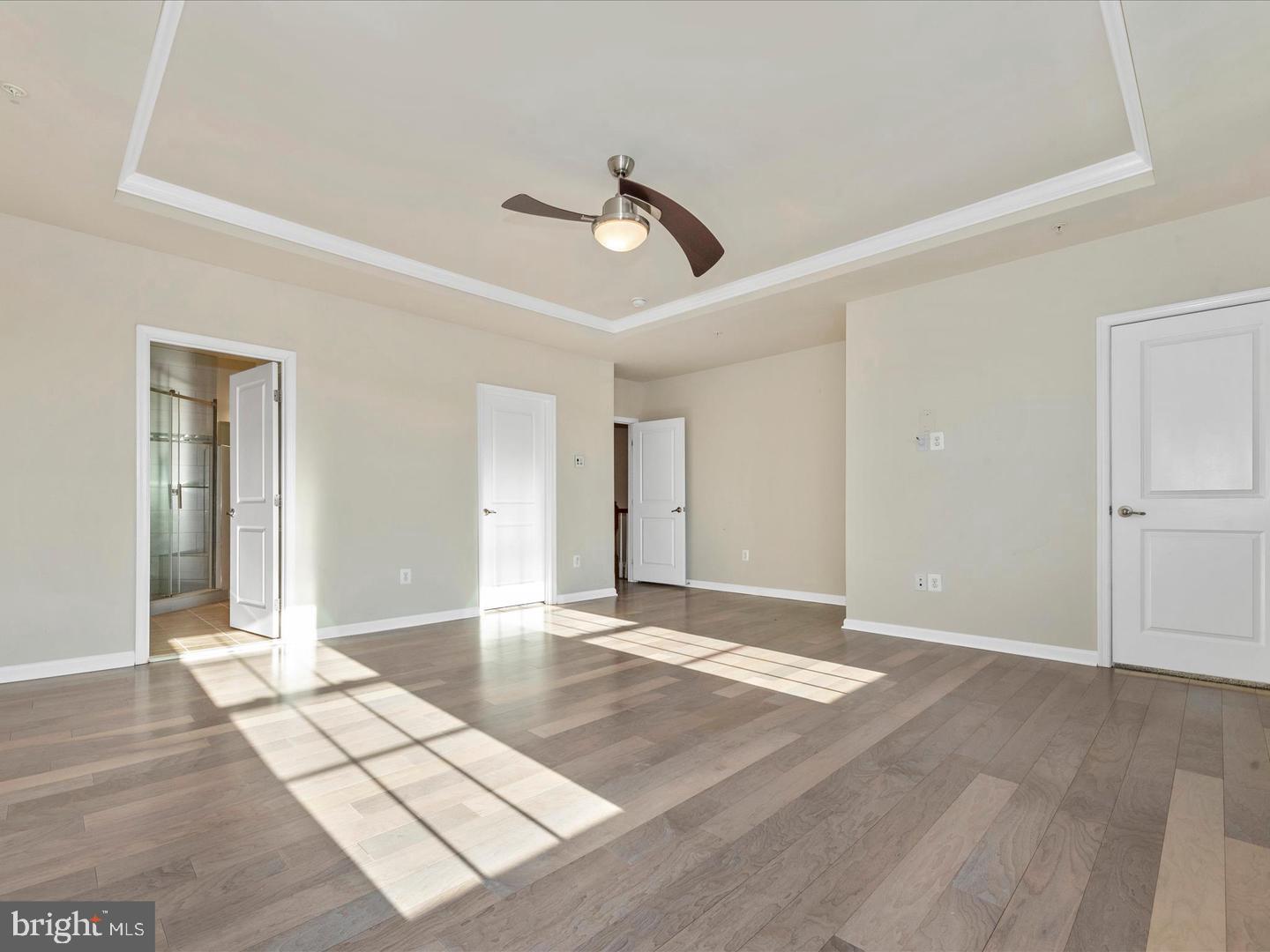 208 B Mill Pond Road Frederick, MD 21701 - Photo 24 of 45 a view of an empty room with wooden floor