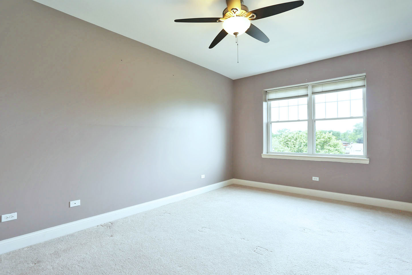 1 Itasca Place, Unit 304 Addison, IL 60143 - Photo 11 of 25 an empty room with a window and a fan