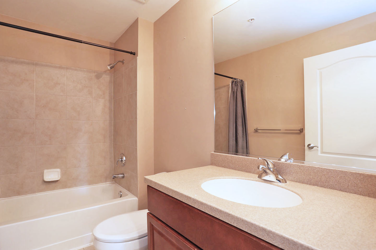 1 Itasca Place, Unit 304 Addison, IL 60143 - Photo 18 of 25 a bathroom with a granite countertop sink toilet and shower