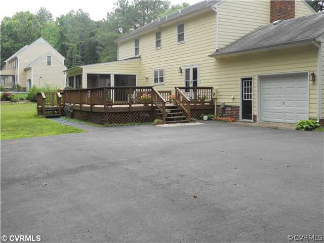 8100 Sinclair Road Mechanicsville, VA 23111 - Photo 10 of 12 Exterior Back - Rear view of home showing large pa