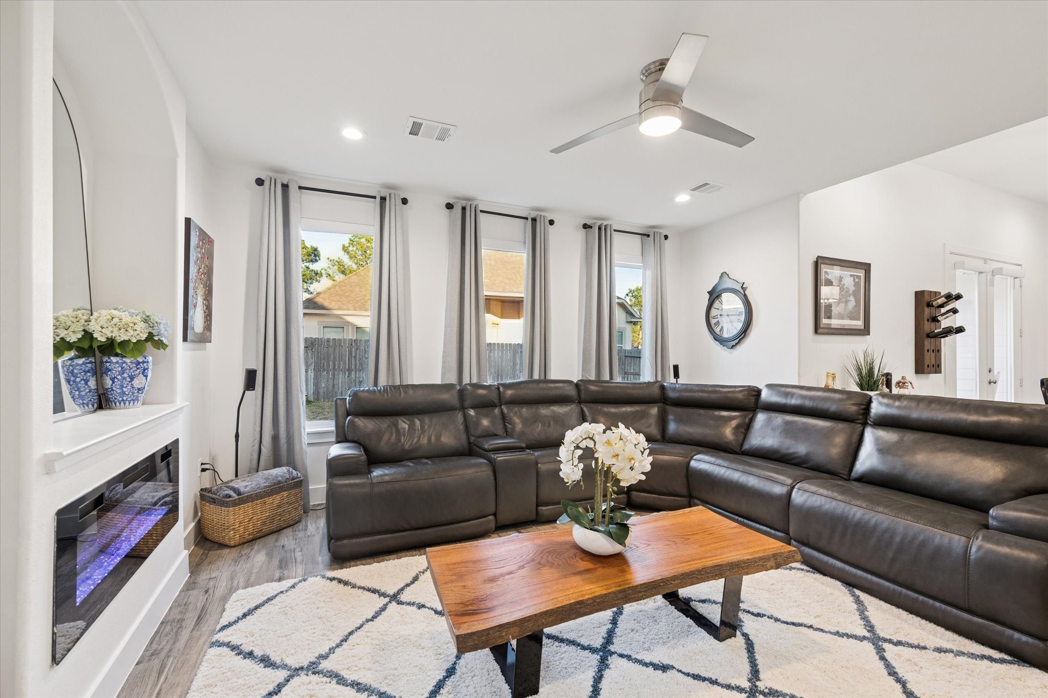 203 Hampton Glen Road Montgomery, TX 77356 - Photo 4 of 28 This view of the living room showcases the abundant natural light flowing through the windows, enhancing the home’s warm and inviting feel. A comfortable and serene space, ideal for unwinding on the sofa and enjoying quality time with family after a long day.