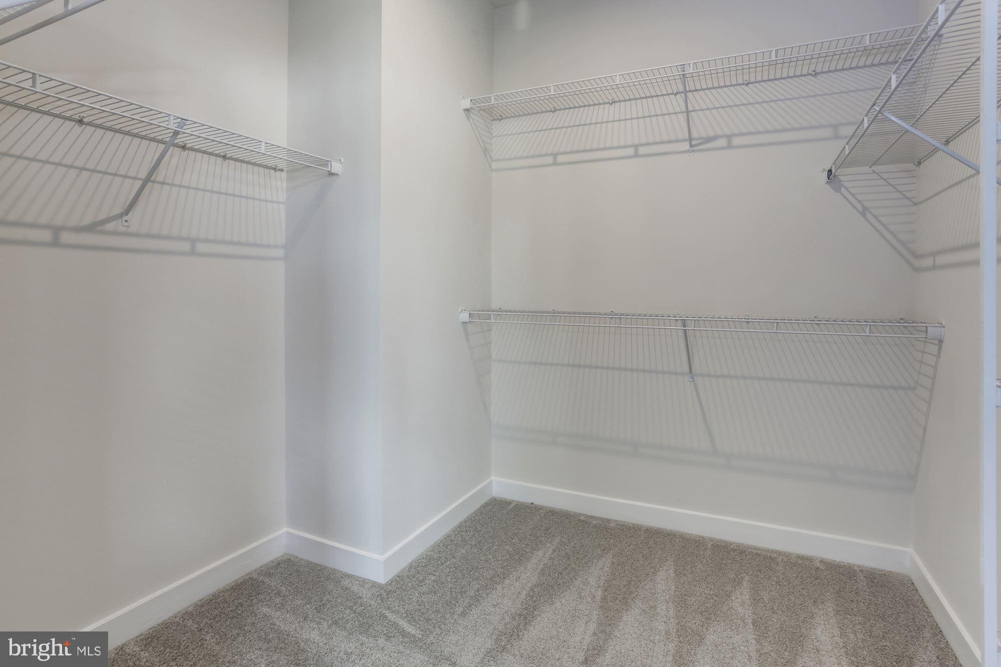 7928 Brandy Station Road, Unit SERENADE Hanover, MD 21076 - Photo 15 of 26 a view of a room with racks on the wall