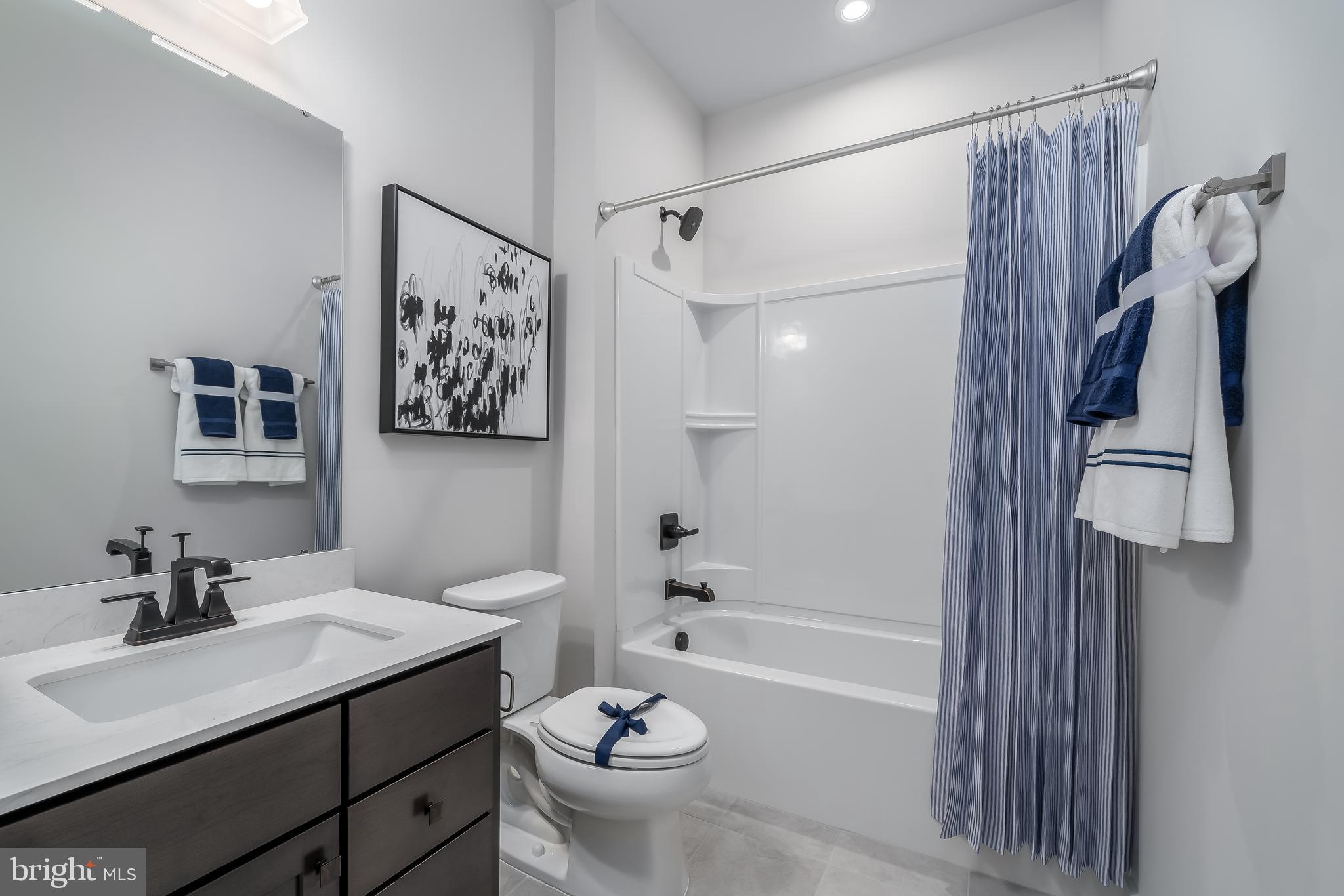 7928 Brandy Station Road, Unit SERENADE Hanover, MD 21076 - Photo 20 of 26 a bathroom with a sink a toilet and shower
