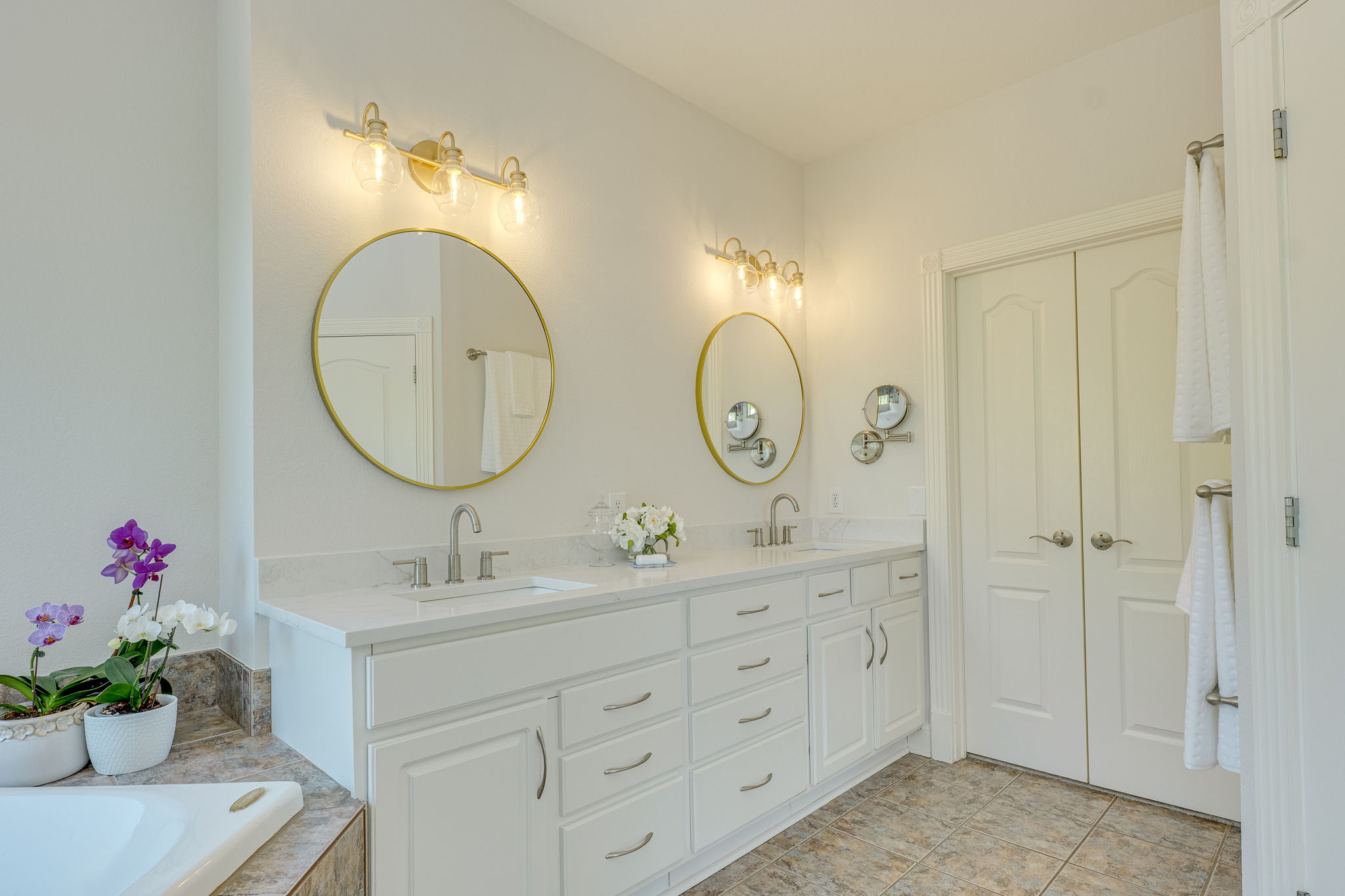 4424 Lago Viento Austin, TX 78734 - Photo 23 of 38 Primary bath has updated quartz counter top, new mirrors and lighting.