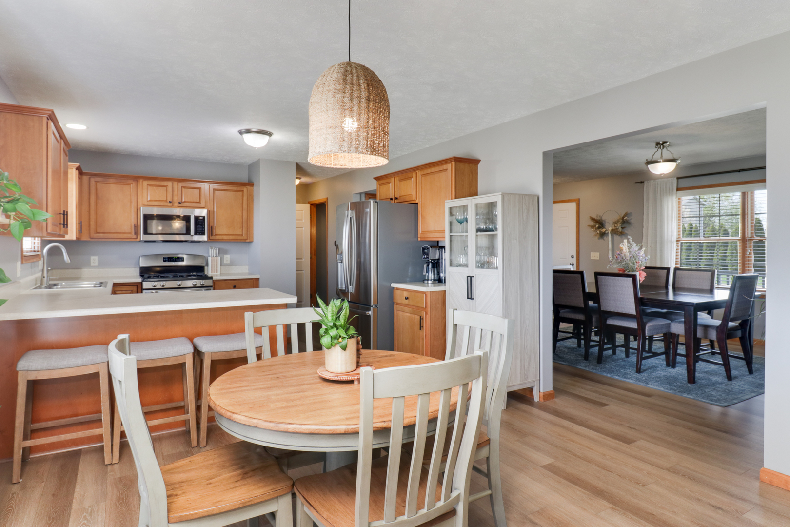 1820 Chuck Murray Drive Normal, IL 61761 - Photo 14 of 46 a view of a dining room with furniture a chandelier and wooden floor