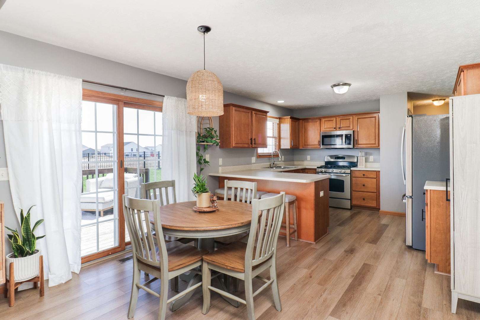 1820 Chuck Murray Drive Normal, IL 61761 - Photo 15 of 46 a kitchen with a table chairs refrigerator and microwave
