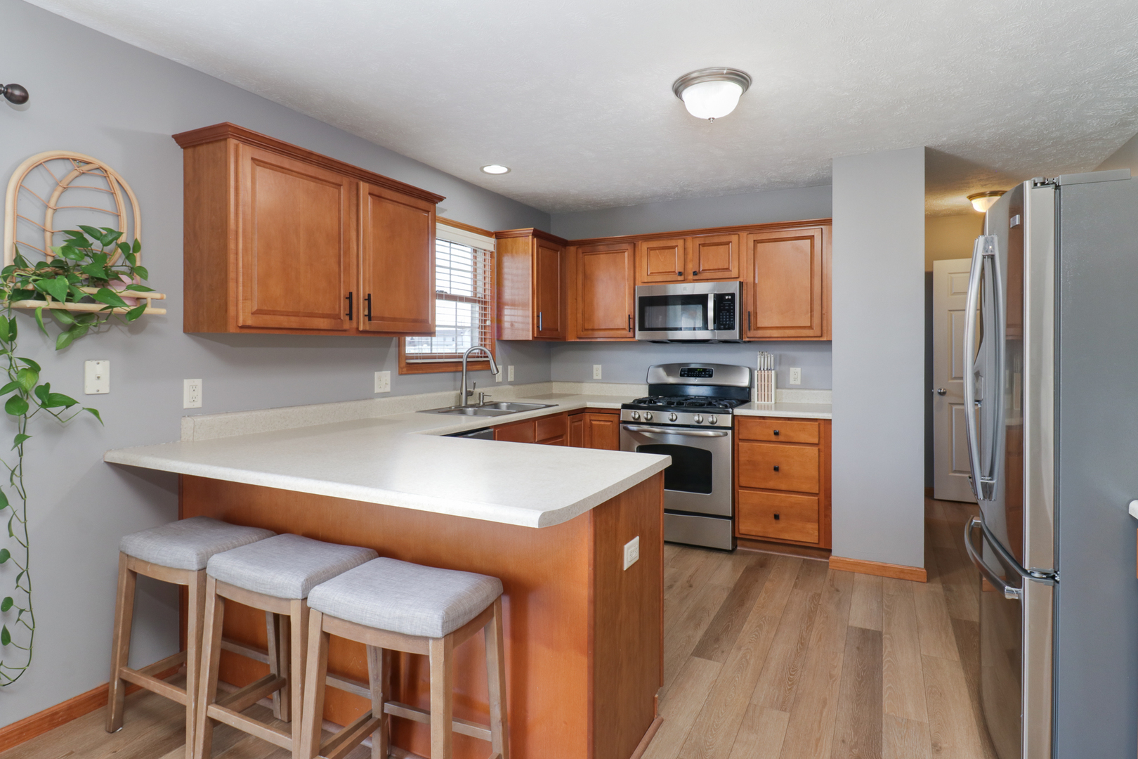 1820 Chuck Murray Drive Normal, IL 61761 - Photo 17 of 46 a kitchen with stainless steel appliances a stove a sink dishwasher and a refrigerator