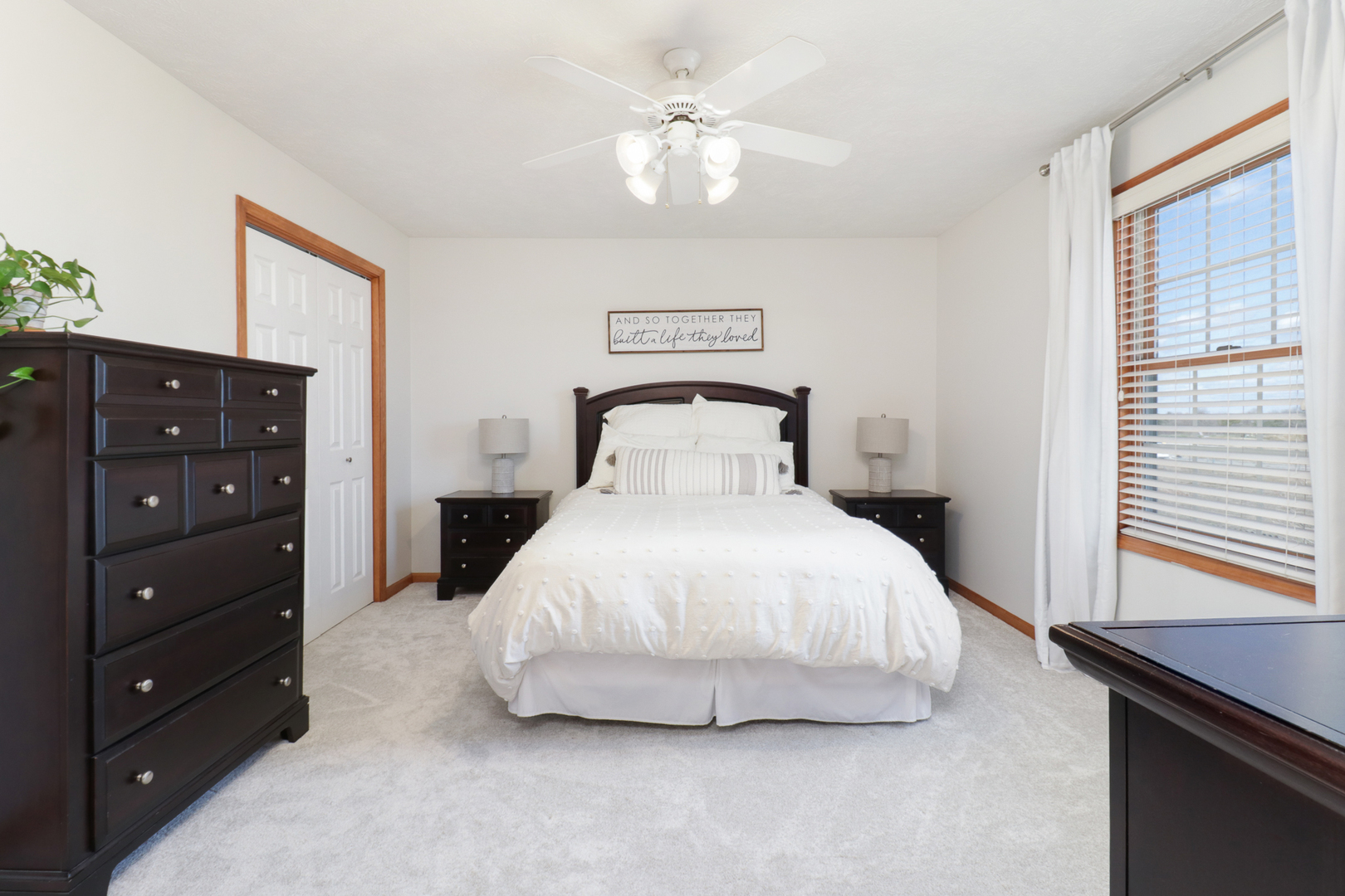 1820 Chuck Murray Drive Normal, IL 61761 - Photo 22 of 46 a bedroom with a bed and a chandelier