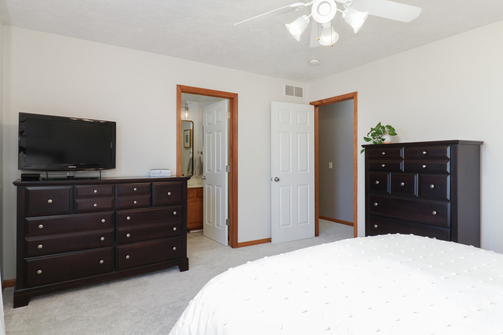 1820 Chuck Murray Drive Normal, IL 61761 - Photo 23 of 46 a bedroom with a bed and a flat tv screen on dresser